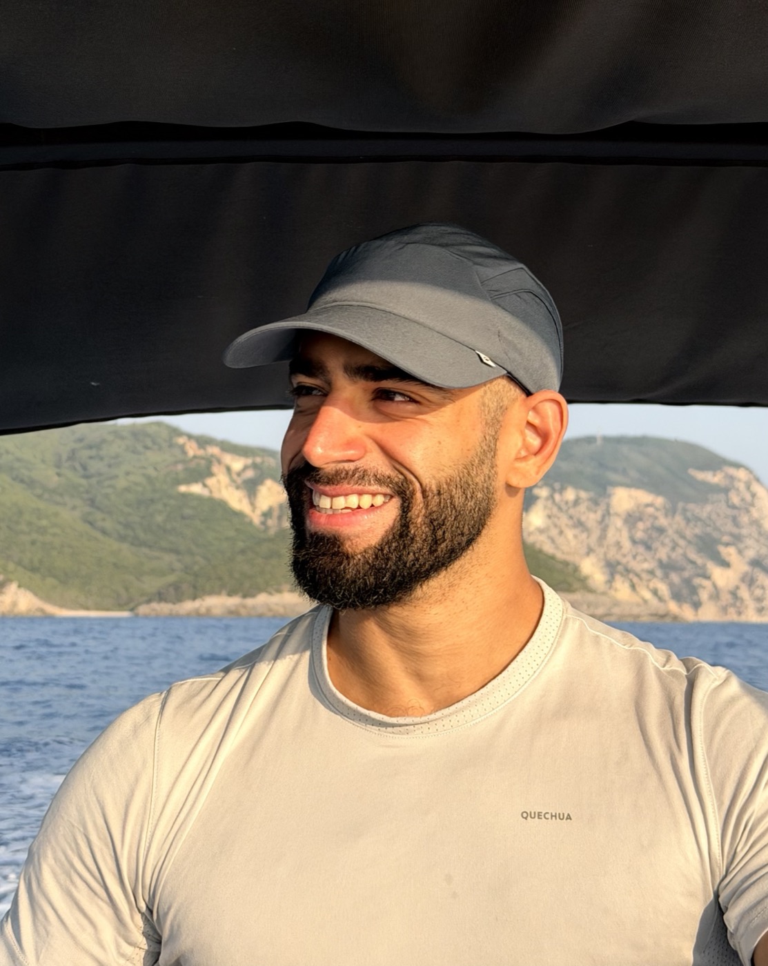Najib smiling on a boat in the sunshine